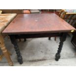 AN EARLY 20TH CENTURY BARLEYTWIST DRAW-LEAF DINING TABLE