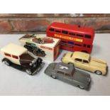 FOUR 1960'S FRICTION VEHICLES TO INCLUDE A LONDON BUS AND TWO ROLL ROYCE WITH A BOXED 1930 FORD