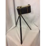 A VINTAGE KODAK CAMERA AND SMALL TRIPOD