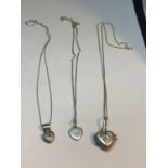 THREE MARKED SILVER NECKLACES WITH HEART SHAPED PENDANTS TO INCLUDE A LOCKET