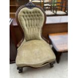 A VICTORIAN WALNUT SPOON BACK NURSING CHAIR WITH CARVED TOP RAIL
