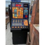 A RETRO FRUIT MACHINE WITH KEY BELIEVED IN WORKING ORDER BUT NO WARRANTY