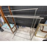 THREE CHROME CLOTHES RAILS