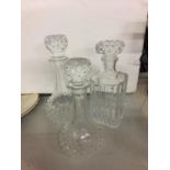 THREE GLASS DECANTERS