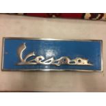 A BLUE AND CHROME VESPA CAST SIGN