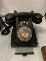 A VINTAGE BLACK 1950'S GPO 164 49 BAKELITE ROTARY DIAL TELEPHONE WITH ON/OFF BELL BUTTONS AND A PULL