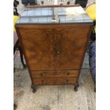 A WALNUT TALLBOY WITH TWO DOORS ABOVE TWO DRAWERS