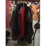 THREE LADIES JACKET, A CAPE AND A MAN'S WAXED JACKET