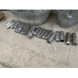 AN ASSORTMENT OF STAINLESS STEEL AND GLASS MILKING CLUSTER SPARES