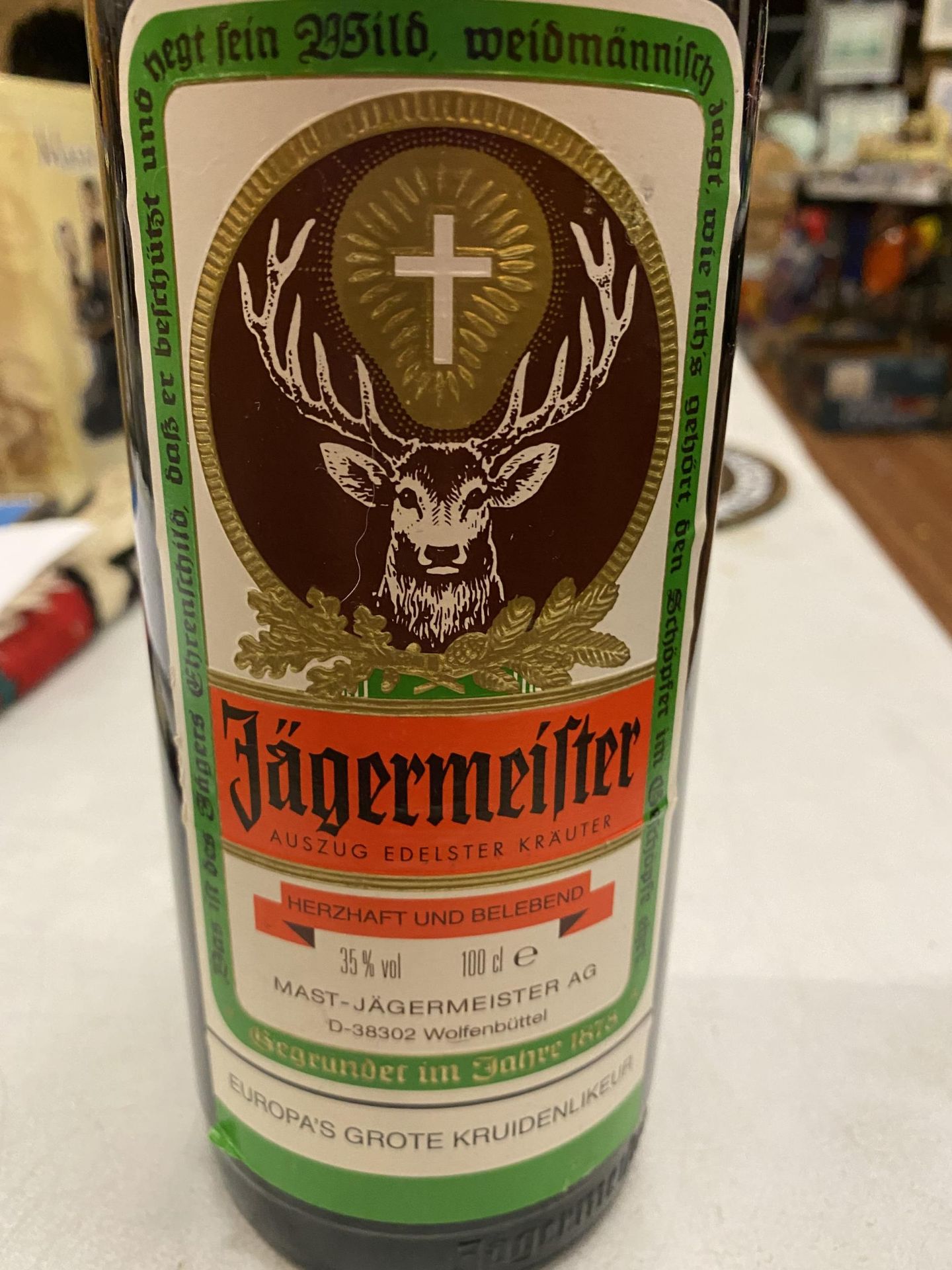 A 1 LITRE BOTTLE OF JAGERMEISTER 35% VOL - Image 2 of 2