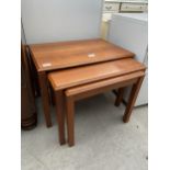 A RETRO TEAK NEST OF THREE TABLES STAMPED 'TRIOH, MADE IN DENMARK 81'