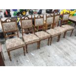 A SET OF SIX OAK LATE VICTORIAN DINING CHAIRS
