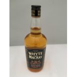 A 1 LITRE BOTTLE OF WHYTE AND MACKAY SCOTCH WHISKY MATURED TWICE EXTRA STRENGTH 52.5% VOLUME