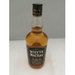 A 1 LITRE BOTTLE OF WHYTE AND MACKAY SCOTCH WHISKY MATURED TWICE EXTRA STRENGTH 52.5% VOLUME