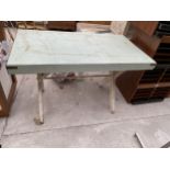 A FORMICA TOPPED X FRAMED TABLE