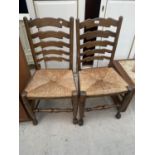 A PAIR OF LANCS STYLE LADDER-BACK CHAIRS