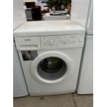 A WHITE SIEMENS WASHING MACHINE