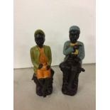 TWO FIGURINES OF A MAN AND LADY