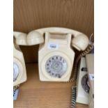 A RETRO CREAM ROTARY DIAL WALL MOUNTED TELEPHONE