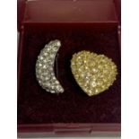TWO BROOCHES, DIAMANTE ENCRUSTED IN THE FORM OF A YELLOW METAL HEART AND A WHITE METAL CRESCENT MOON