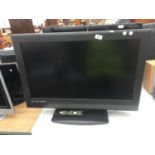 A 32" TEVION TELEVISION WITH REMOTE CONTROL