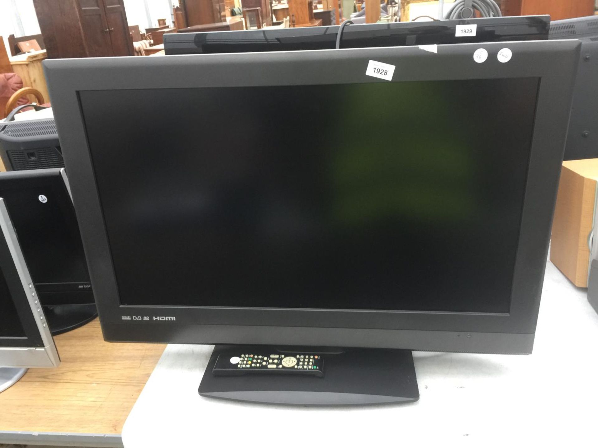 A 32" TEVION TELEVISION WITH REMOTE CONTROL