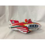 A TIN PLATE ROCKET TOY