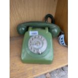 A RETRO GREEN ROTARY DIAL TELEPHONE