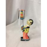 A TIN PLATE CLOWN TOY