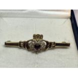 A 9 CARAT GOLD CLADDAGH BRROCH WITH RUBY AND DIAMONDS GROSS WEIGHT 2.8 GRAMS WITH A PRESENTAION BOX