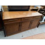 A RETRO TEAK G-PLAN SIDEBOARD ENCLOSING THREE DRAWERS AND THREE CUPBOARDS, 56" WIDE