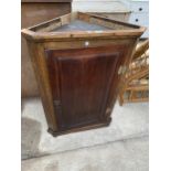 A GEORGE III OAK CORNER CUPBOARD, 27" WIDE, WITH SHAPED INTERIOR SHELF