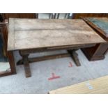 A JACOBEAN STYLE OAK REFECTORY DINING TABLE WITH PINEAPPLE PEDESTALS AND CARVED FRIEZE, 60 X 32" (