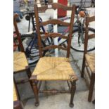 A LANCASHIRE STYLE OAK LADDER BACK DINING CHAIR WITH RUSH SEAT