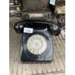 A RETRO BLACK ROTARY DIAL TELEPHONE