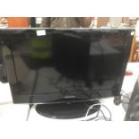 A SAMSUNG 26" TELEVISION WITH REMOTE CONTROL