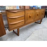 A RETRO TEAK STATEROOM SIDEBOARD, 71.5" WIDE, ENCLOSING TWO DRAWERS, TWO CUPBOARDS AND A COCKTAIL