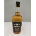 A 1 LITRE BOTTLE OF WHYTE AND MACKAY SCOTCH WHISKY MATURED TWICE EXTRA STRENGTH 52.5% VOLUME