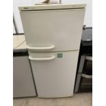 A WHITE BOSCH CLASSIX UPRIGHT FRIDGE FREEZER WITH INSTRUCTION MANUAL