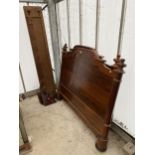 A VICTORIAN MAHOGANY 4'6" BEDSTEAD WITH TURNED COLUMNS AND TERMINALS