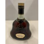 A BELL SHAPED BOTTLE OF HENNESSY COGNAC XO IN A BELL SHAPED DECORATIVE BOTTLE