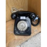 A RETRO BLACK ROTARY DIAL TELEPHONE