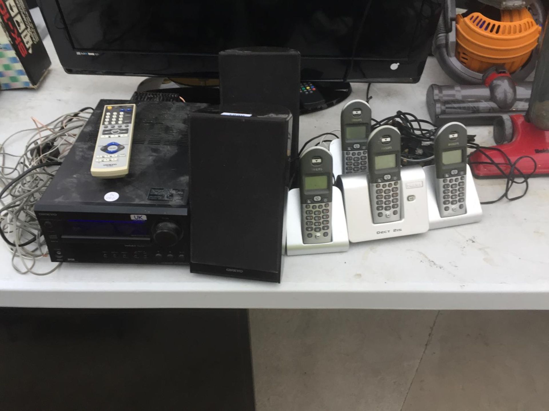 AN ONKYO CD PLAYER WITH TWO SPEAKERS, AND FOUR HOUSE PHONES