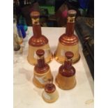 TWO LARGE, TWO MEDIUM AND ONE SMALL WADES WHISKY BELLS