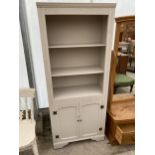 A MODERN THREE TIER OPEN BOOKCASE WITH TWO CUPBOARDS TO THE BASE, 29" WIDE