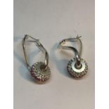A PAIR OF MARKED SILVER TWIST EARRINGS WITH CHARMS