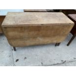 A 19TH CENTURY OAK DROP-LEAF DINING TABLE