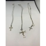 THREE SILVER CHAINS WITH CROSS PENDANTS