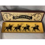 A BOXED BRITIANS THE EMPRESS OF INDIA'S 21ST LANCERS FOUR PIECE HORSE MOUNTED MODEL SOLDIER SET -
