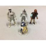 FOUR VINTAGE STAR WARS FIGURES TO INCLUDE R2D2 IN WORKING ORDER AND THREE OTHER FURTHER FIGURES